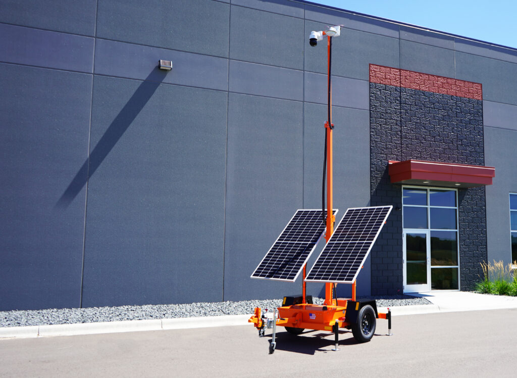 Mobile surveillance trailer in front of building